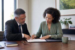 Attorney and client reviewing a power of attorney before signature